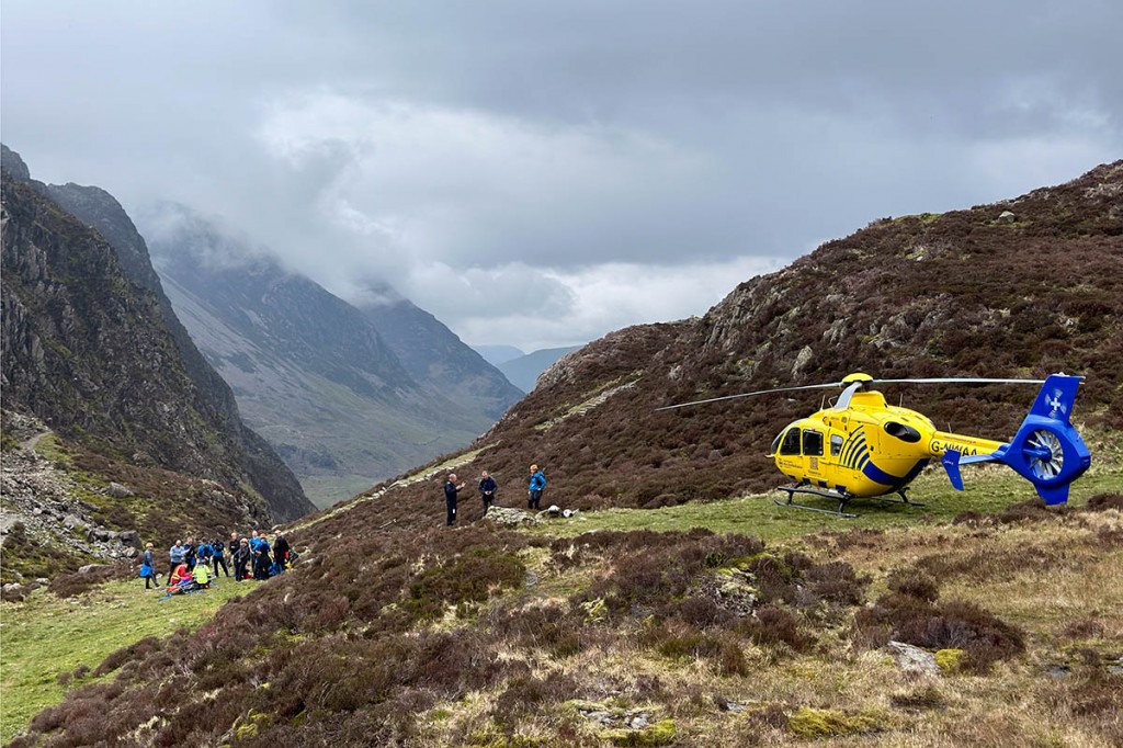 Rescuers and the air ambulance at the site near Haystacks. Photo: Cockermouth MRT