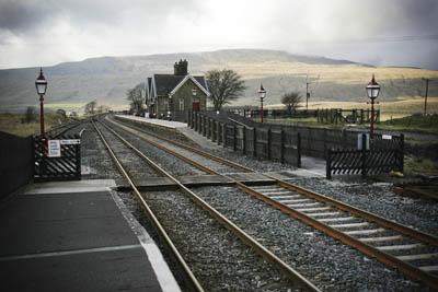 Ribblehead station, with Whernside in the distrance. Stations along the line are the start points for walks