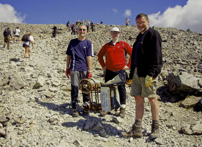 John Muir Trust's Sandy Maxwell in the foreground with two volunteers and the wheelchair