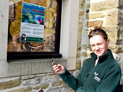 Meghann Hull demonstrates the Bluetooth facility outside the Grassington national park centre. Photo: Yorkshire Dales National Park Authority