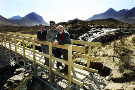 Skye Mountain Rescue Team Leader Gerry Akroyd, Hugh Macleod of Macleod Estate and Councillor John Laing on the new bridge at Allt Dearg, Sligachan 