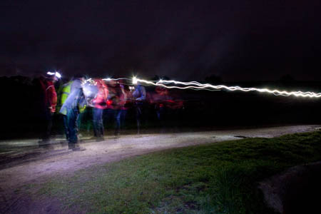 Hikers leave their headtorch trails as they approach checkpoint staff at Yarnbury in the middle of the night
