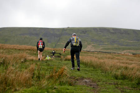 Two peaks down, eight to go: runners tackle the steep rise to Gragareth