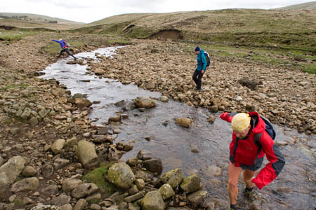 Fellsman competitors cross Kingsdale Beck