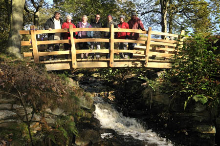 Opening the new Hoodbrook Bridge: from left, national park chair Narendra Bajaria, Mrs Muriel Prigent, Councillor Jane Marsden, Mike Rhodes, craftsman Robin Wood, Ellie Dunn and Andy Bentham, both of the countryside maintenance team.