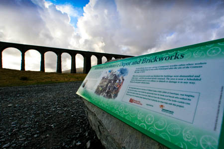 Ribblehead viaduct and one of the interpretation boards detailing the archaeology of the area