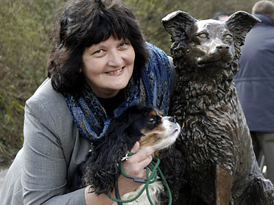 Sculptress JOEL is pictured with the bronze sculpture of Ruswarp, and her own cavalier king charles spaniel Chloe 