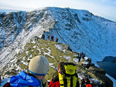 Winter walkers on Striding Edge heading for Helvellyn