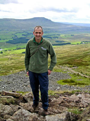 Steve Hastie, with Ingleborough in the distance. Photo: Yorkshire Dales National Park Authority