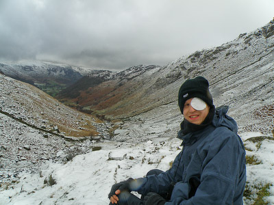 Tom Buckley pauses on his Coast-to-Coast walk in a snowy Lake District