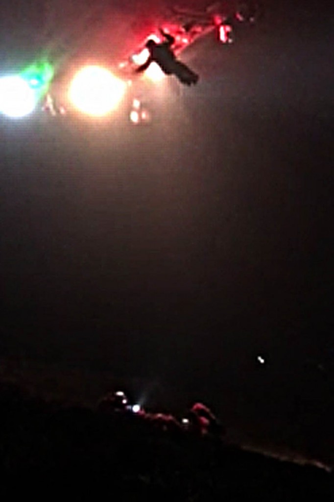 The winchman is lowered from the Coastguard helicopter at the scene. Photo: Aberdyfi SRT The winchman is lowered from the Coastguard helicopter at the scene. Photo: Aberdyfi SRT