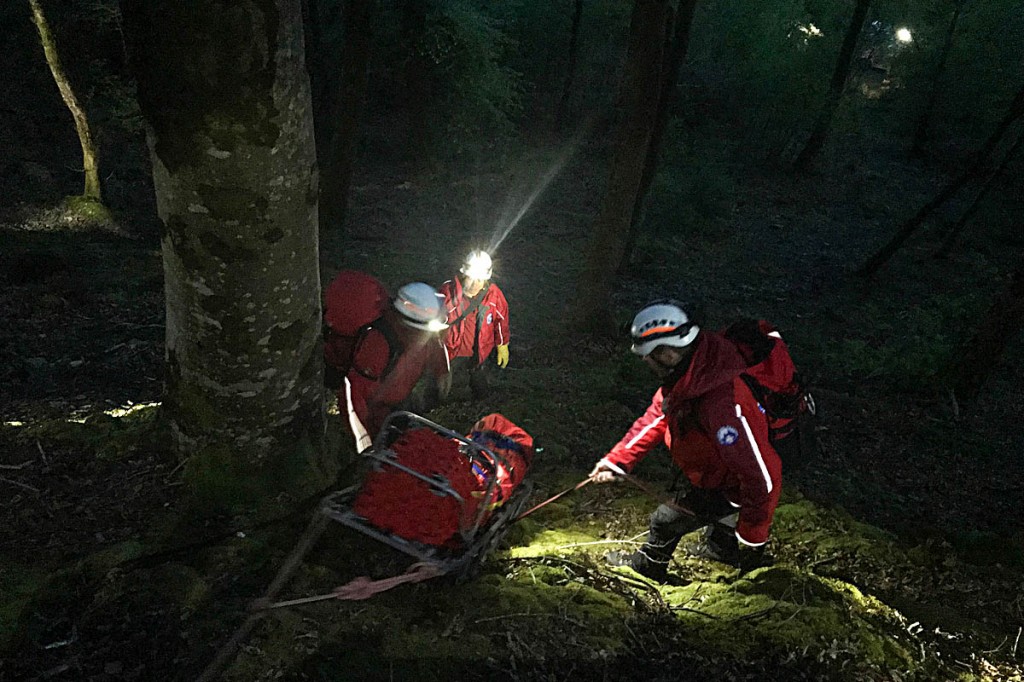 The injured man is lowered down the steep slope. Photo: Aberdyfi SRT