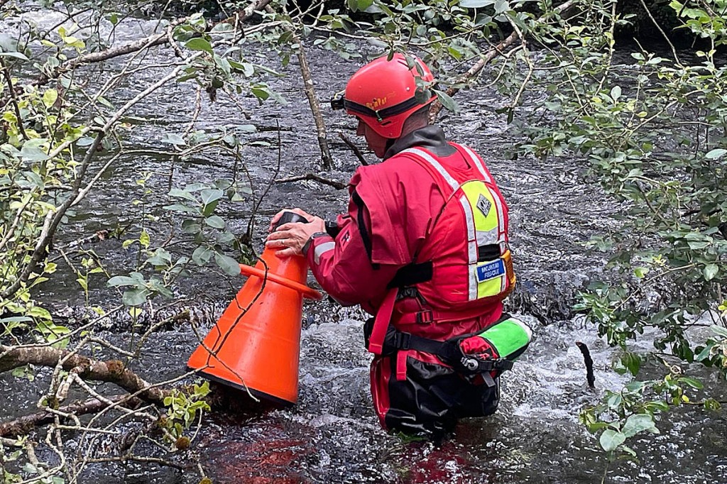 An Aberdyfi team member searches water debris near Llanidloes. Photo: Aberdyfi SRT An Aberdyfi team member searches water debris near Llanidloes. Photo: Aberdyfi SRT