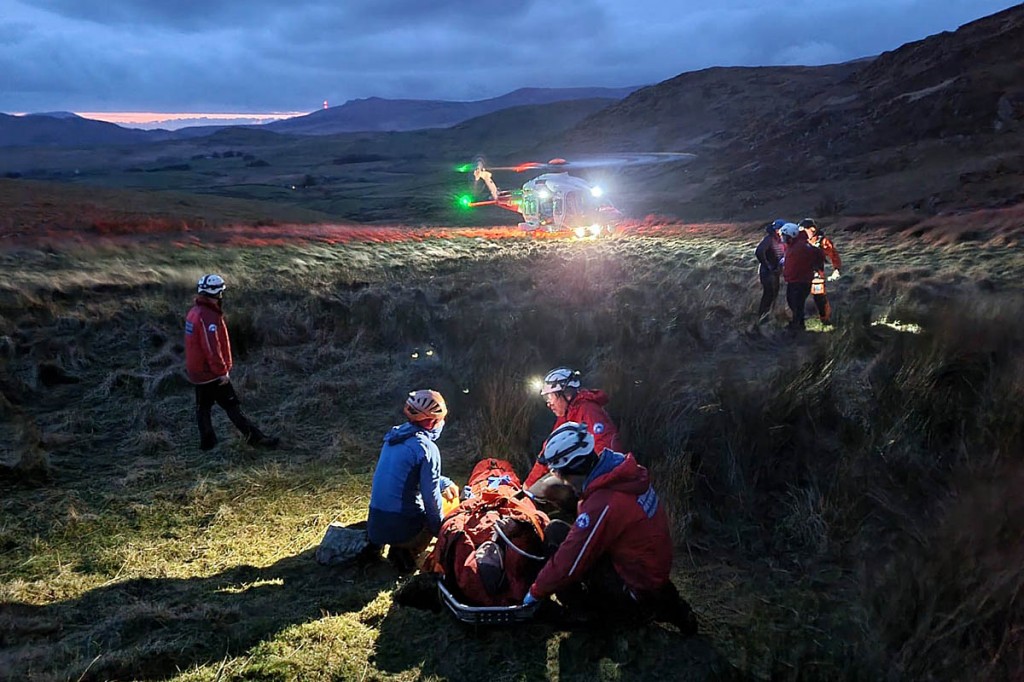 Rescuers and the Coastguard helicopter at the scene. Photo: Aberglaslyn MRT