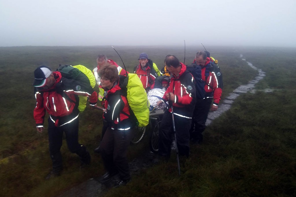 Rescuers stretcher the injured walker from the Pennine Way. Photo: BSARU Rescuers stretcher the injured walker from the Pennine Way. Photo: BSARU