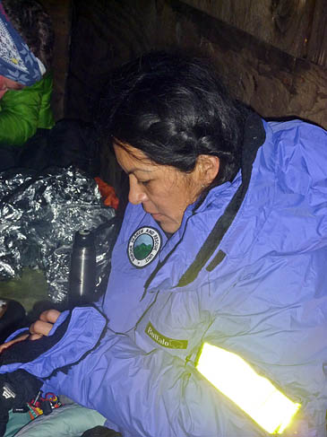 Annie Garcia of Peru is rewarmed by rescuers. Photo: BSARU