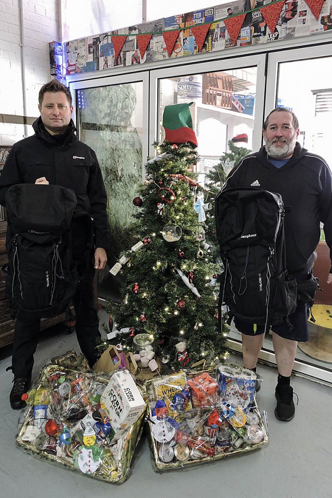 George Clarke, left, and Brian Burridge with some of the donated rucksacks