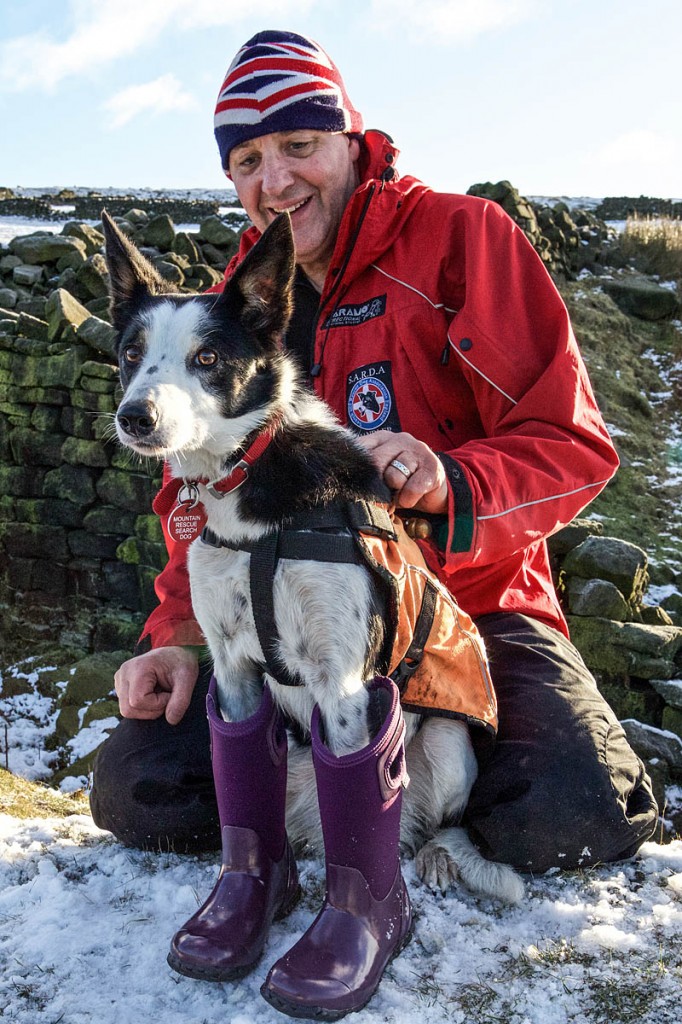 Search dog Belle tries a pair of Bogs boots with handler Andy Colau. Sadly, the wellies only come in versions for humans