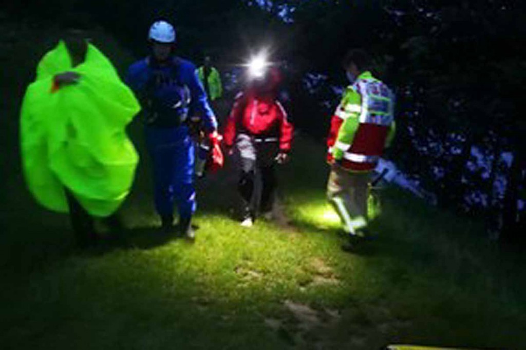 Rescuers walk the canoeists to safety. Photo: Bowland Pennine MRT