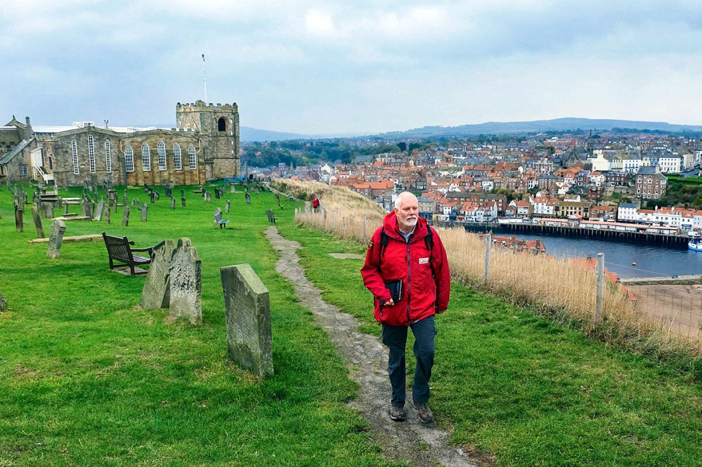 Bernie McLinden, senior ranger for the North York Moors National Park Authority, tries out the new Bram Stoker App on the clifftop above Whitby. Photo: Tony Bartholomew