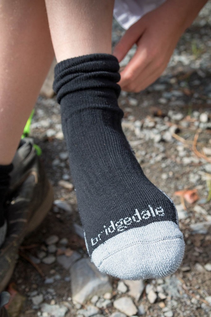 A young Outward Bound visitor tries on the Bridgedale socks. Photo: Gary Short A young Outward Bound visitor tries on the Bridgedale socks. Photo: Gary Short