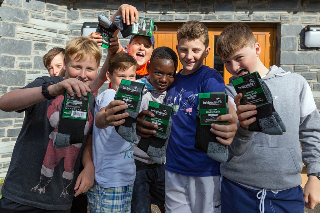Youngsters at the Aberdyfi centre show off their donated socks. Photo: Gary Short Youngsters at the Aberdyfi centre show off their donated socks. Photo: Gary Short