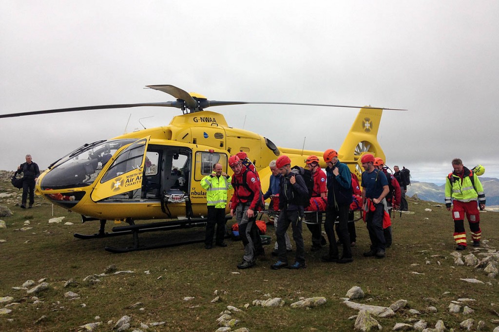 Rescuers and the air ambulance on Swirl How during the Sunday incident. Photo: Coniston MRT Rescuers and the air ambulance on Swirl How during the Sunday incident. Photo: Coniston MRT