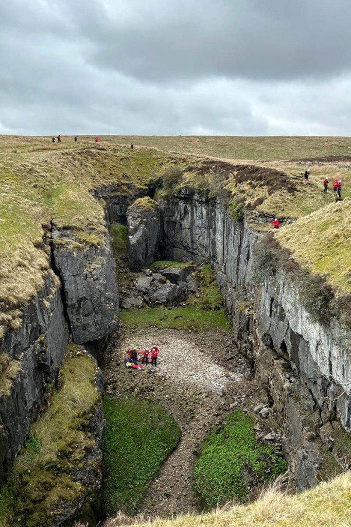 Rescuers with the injured man in Hull Pot. Photo: CRO