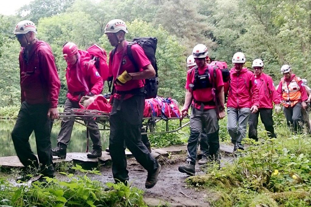 Calder Valley Search and Rescue Team members stretcher the injured walker from the scene at Hardcastle Crags. Photo: Calder Valley SRT