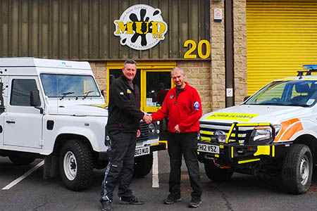 Al Day of the rescue team receives a cheque for £400 from Kevin Baldwin, right, of Mud UK Al Day of the rescue team receives a cheque for £400 from Kevin Baldwin, right, of Mud UK