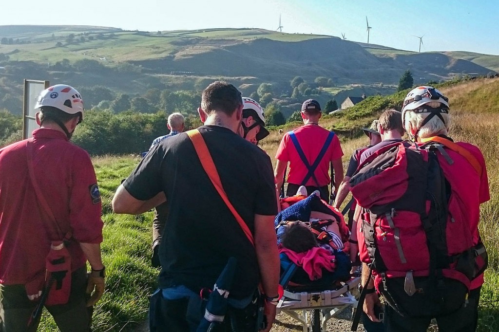 Rescuers stretcher the injured walker from the scene. Photo: Calder Valley SRT Rescuers stretcher the injured walker from the scene. Photo: Calder Valley SRT