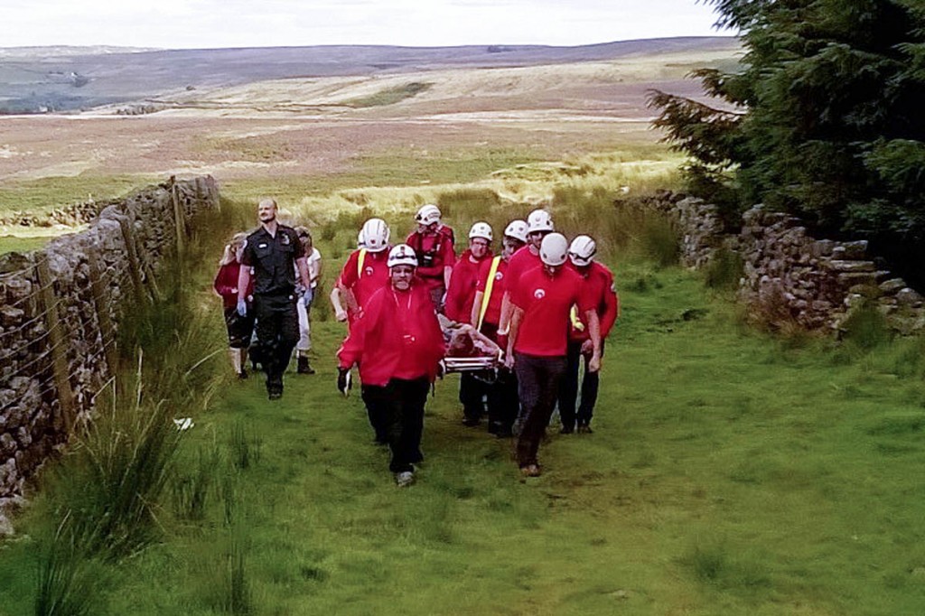 Rescuers stretcher the walker from Brontë Falls. Photo: Calder Valley SRT