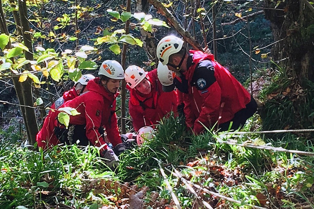 Rescuers with the fallen walker at the scene. Photo: Calder Valley SRT