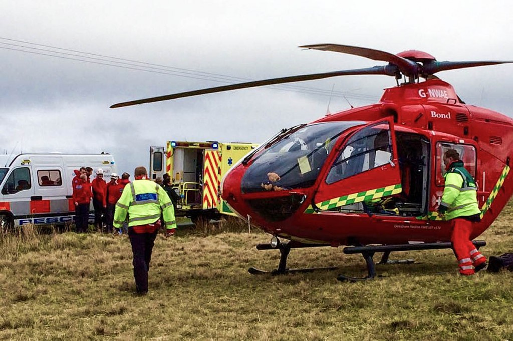 Rescuers at the scene with the air ambulance. Photo: CVSRT