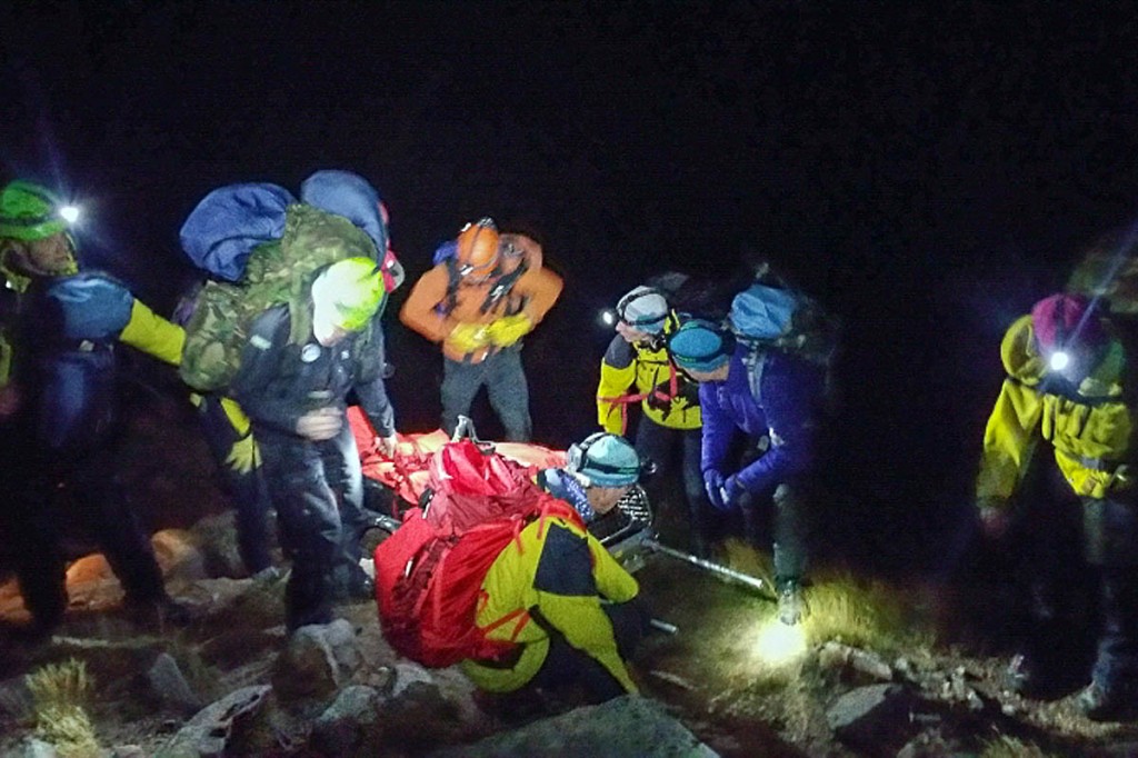 Team members with the injured man during the rescue. Photo: Cairngorm MRT