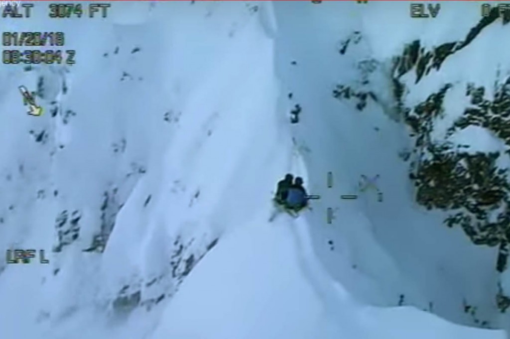 A still from the Coastguard footage showing the pair on the ridge. Image: MCA