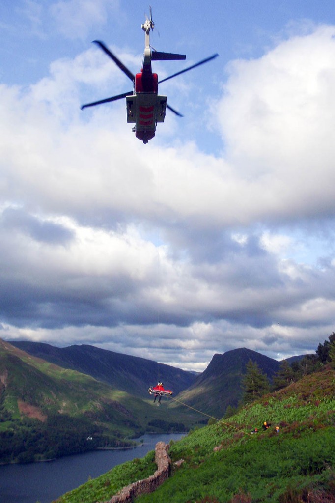 The injured walker is winched into the helicopter. Photo: Cockermouth MRT The injured walker is winched into the helicopter. Photo: Cockermouth MRT