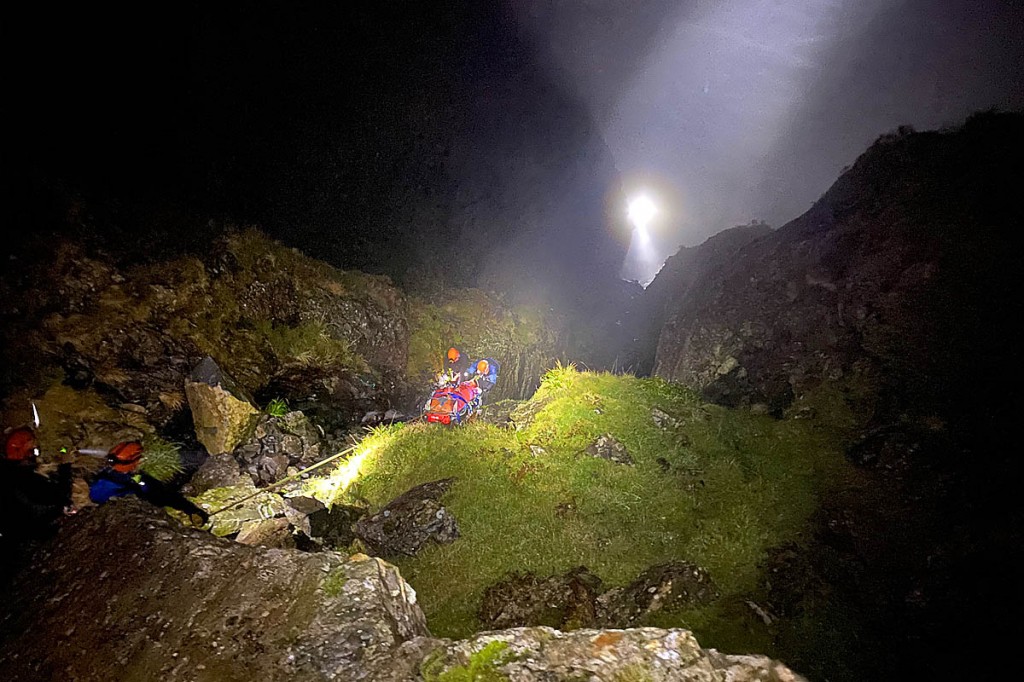 The injured man is lowered down the gully. Photo: Cockermouth MRT