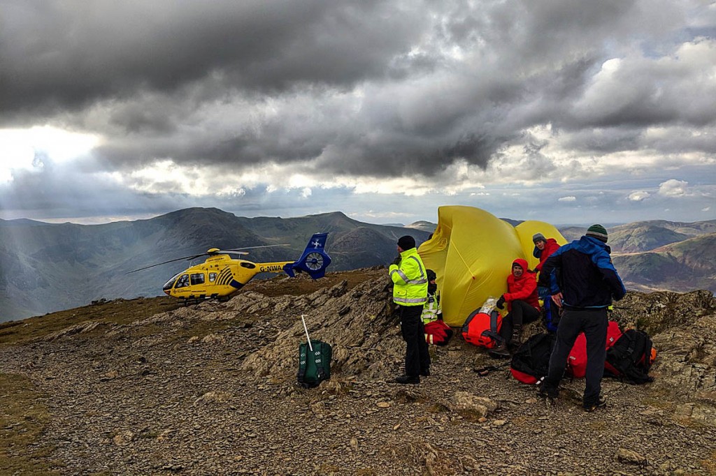 Rescuers in action on the summit of Robinson. Photo: Cockermouth MRT Rescuers in action on the summit of Robinson. Photo: Cockermouth MRT