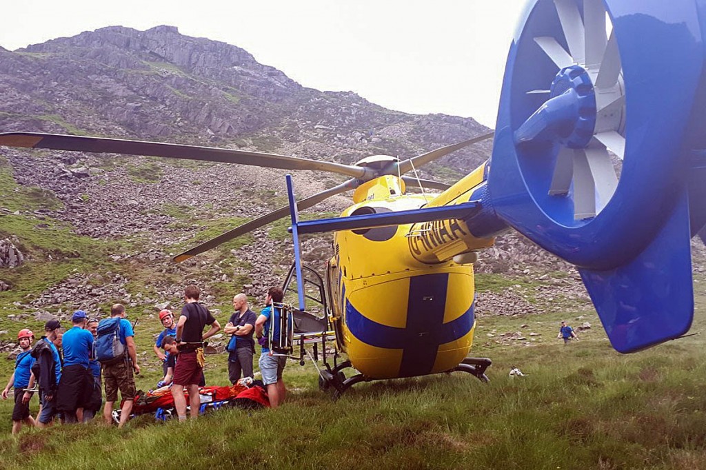 Rescuers with the air ambulance at Scarth Gap. Photo: Cockermouth MRT Rescuers with the air ambulance at Scarth Gap. Photo: Cockermouth MRT
