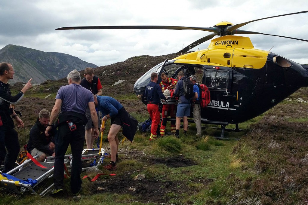 The injured woman is put into the helicopter by rescuers. Photo: Cockermouth MRT