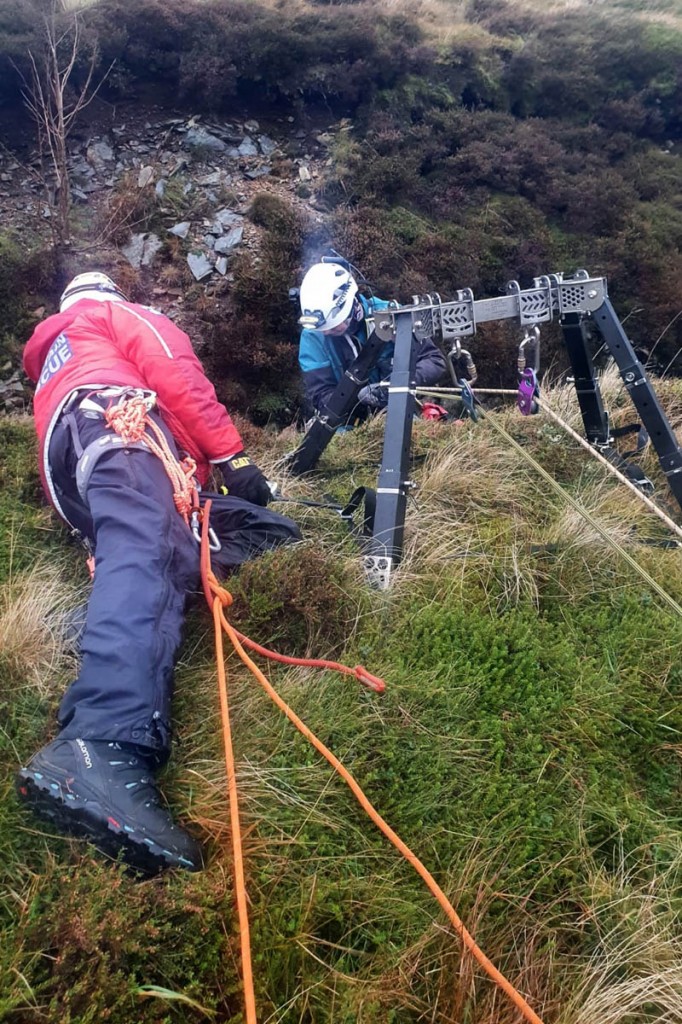 The team member is lowered into the mine. Photo: Chris Little The team member is lowered into the mine. Photo: Chris Little