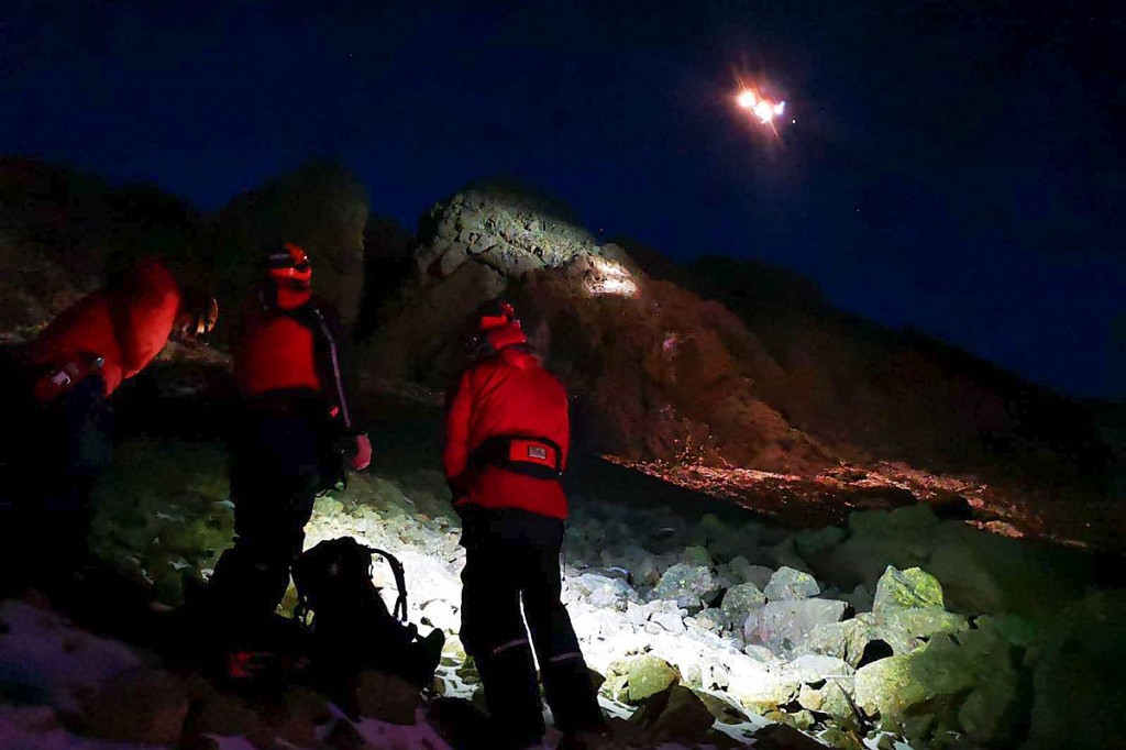 Rescuers and the Coastguard helicopter at the scene on Dow Crag. Photo: Coniston MRT Rescuers and the Coastguard helicopter at the scene on Dow Crag. Photo: Coniston MRT