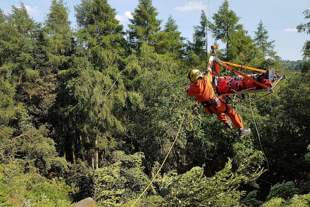 The injured climber is winched into the helicopter. Photo: Derby MRT