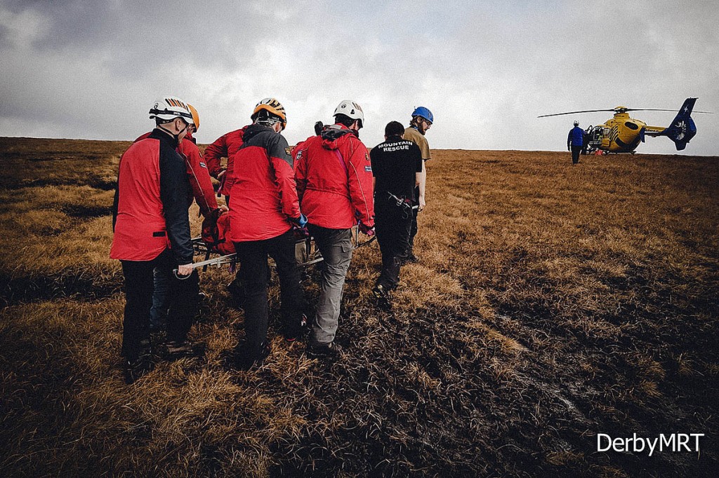 Rescuers stretcher the injured competitor to the waiting air ambulance. Photo: Derby MRT