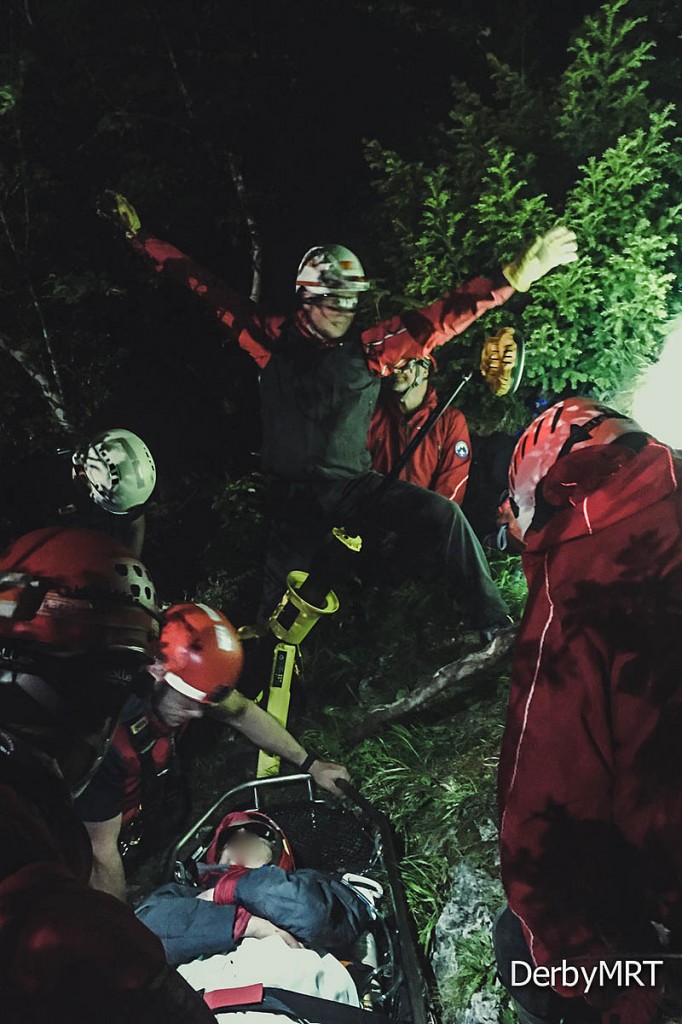 Rescuers with the fallen walker at the scene near Matlock Bath. Photo: Derby MRT Rescuers with the fallen walker at the scene near Matlock Bath. Photo: Derby MRT