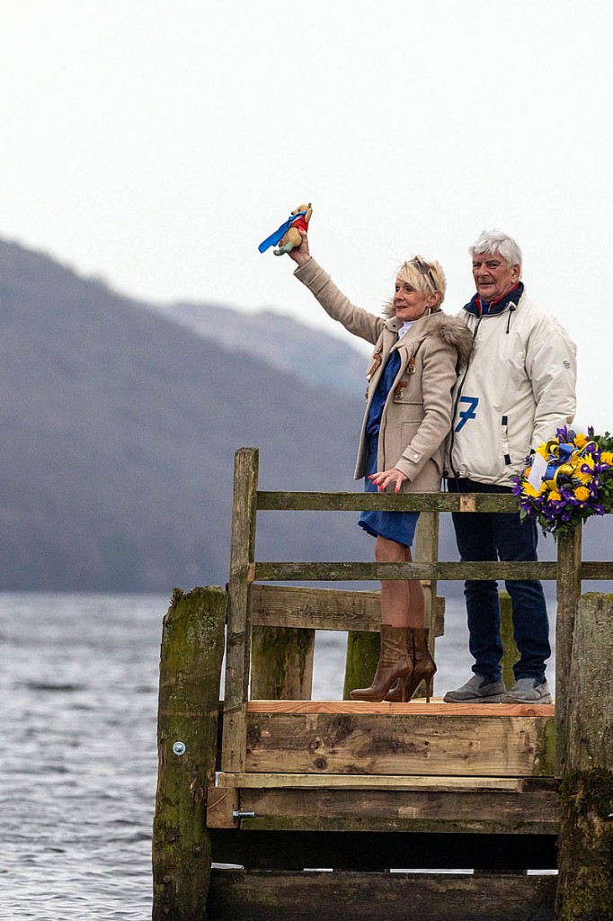 Gina Campbell and her partner Brian Eastham lay a wreath at Coniston Water. Photo: Sgt Peter Devine/ RAF/MOD Crown Copyright