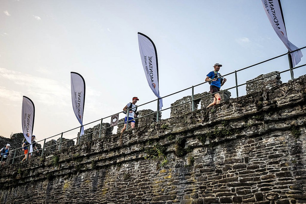 Runners head along the walls of Conwy Castle at the start of the race. Photo: No Limits Photography Runners head along the walls of Conwy Castle at the start of the race. Photo: No Limits Photography