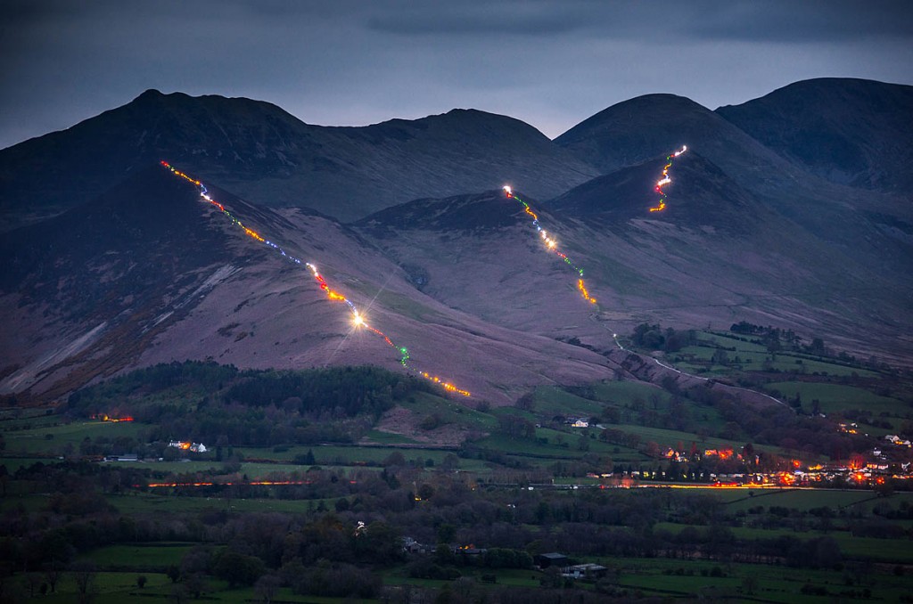 The three fells are illuminated by walkers' headtorches. Photo: Tom McNally The three fells are illuminated by walkers' headtorches. Photo: Tom McNally