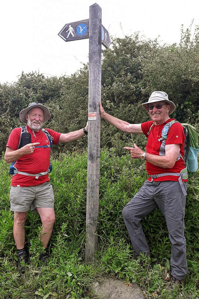 Steve Hayward and Eric Chambers of the Friends of Anglesey Coastal Path place the final plaque Steve Hayward and Eric Chambers of the Friends of Anglesey Coastal Path place the final plaque